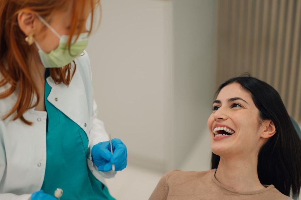 Smiling patient after receiving dental implants in Huntley.