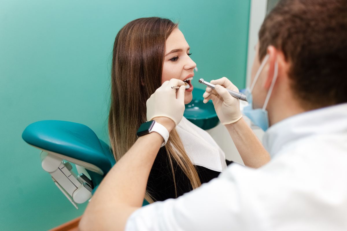 A dentist in Huntley checks a patient’s teeth to prevent bad breath.