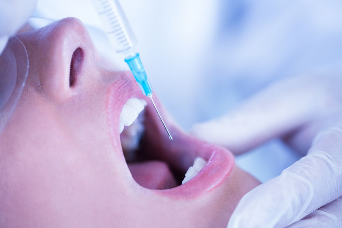 Patient receiving calming sedation during a dental procedure.
